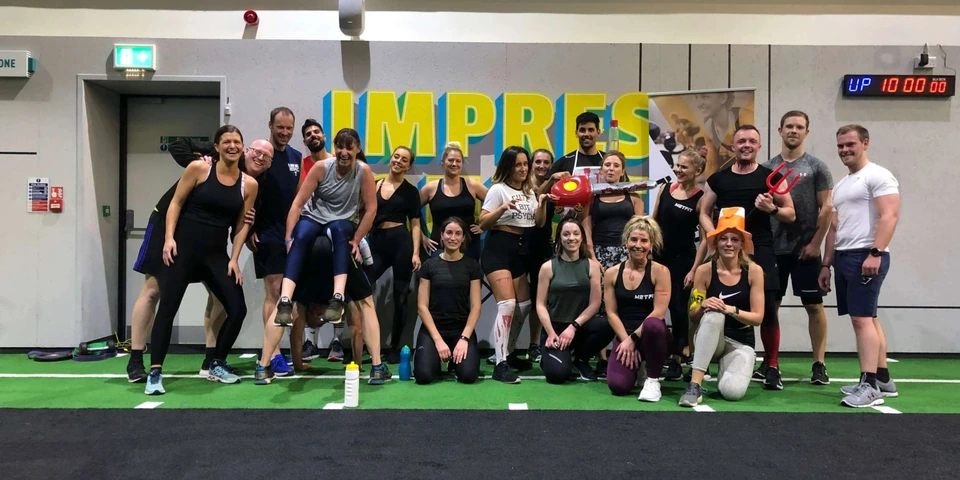 Andres and the MetFit group together after a training session